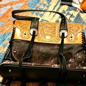 Trinity Ranch  hide on.  Tassels  leather. Bag. NWOT